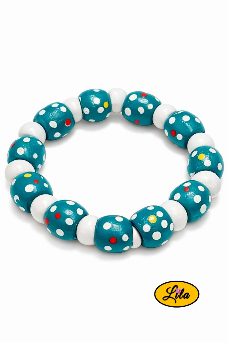 Bracelet perles bois bleues à pois blancs et perles blanches sur fond blanc vue produit