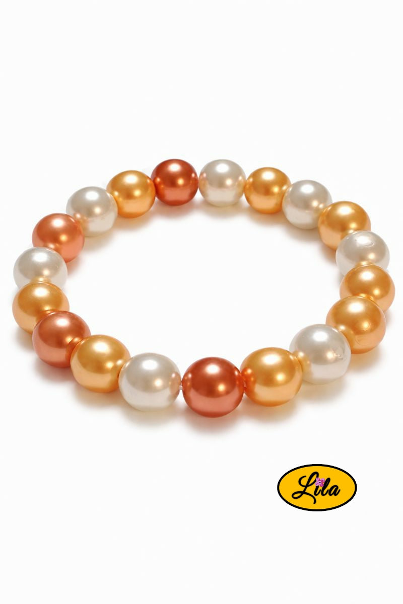 Bracelet perles nacrées blanc jaune et orange sur fond blanc vue produit