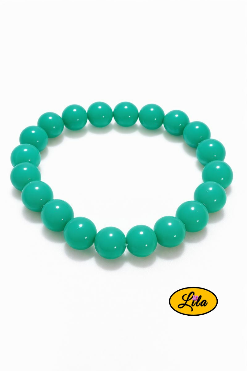 Bracelet en perles turquoise sur fond blanc vue produit