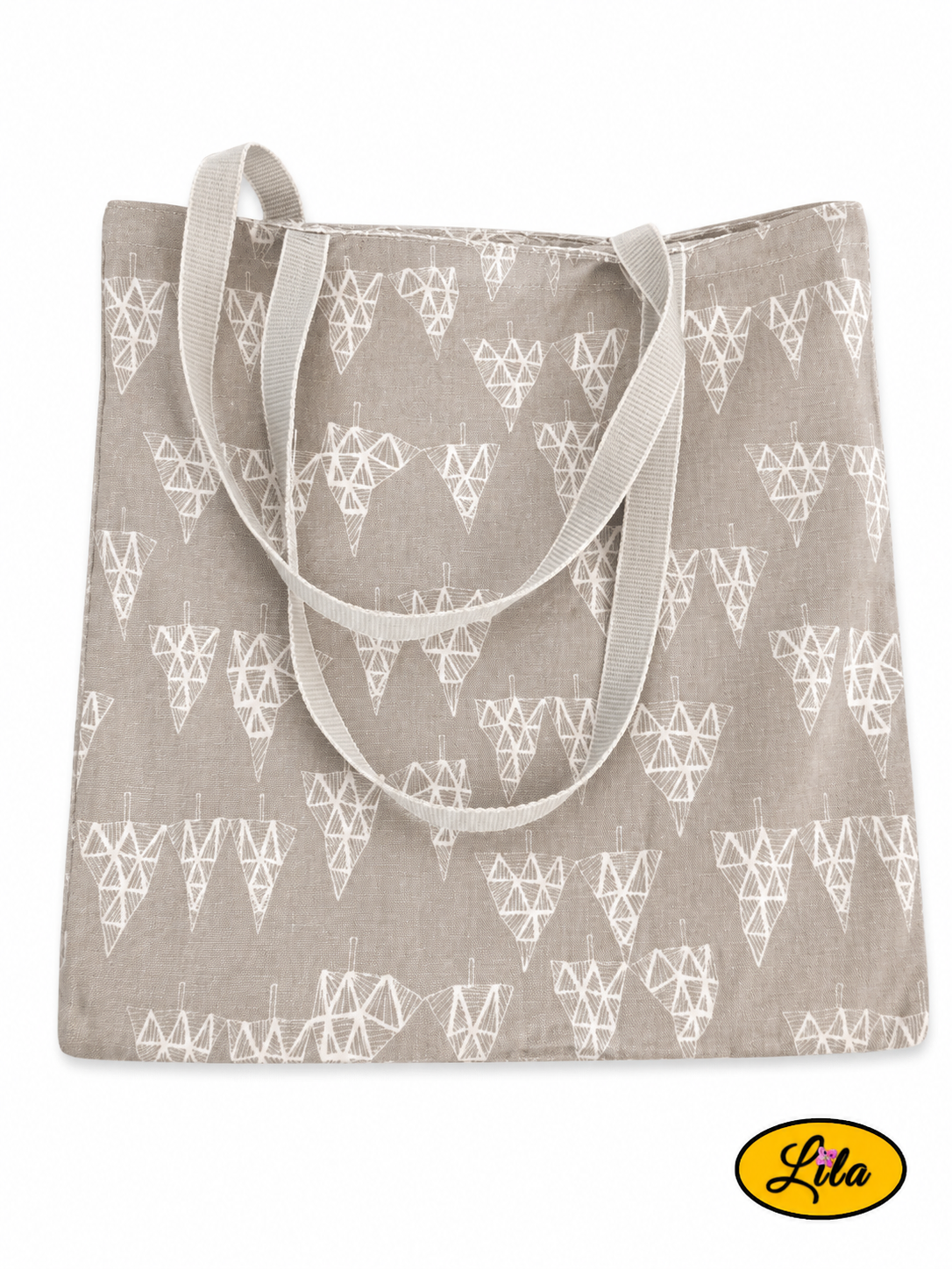 Tote bag en tissu gris à motifs de sapins graphiques gris clair vu de dos en vue de haut sur fond blanc avec les sangles grises posées sur le sac style nature et contemporain
