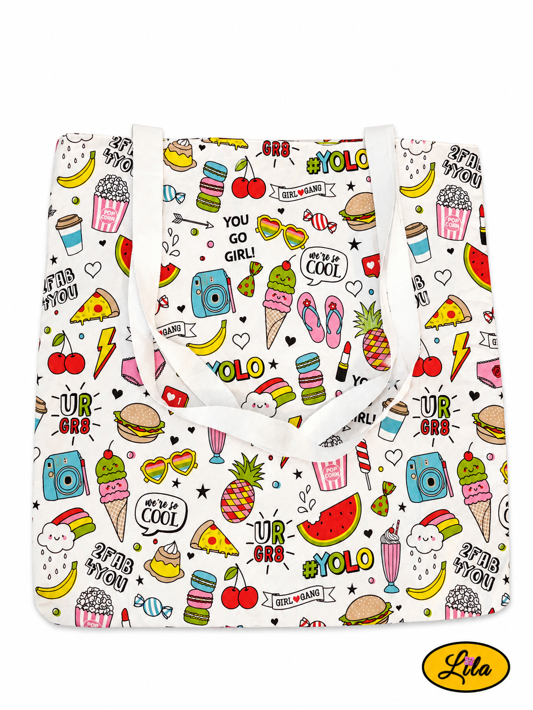 Tote bag en tissu à motifs girly vu de dos en vue de haut sur fond blanc avec sangles blanches posées sur le sac style moderne et artisanal