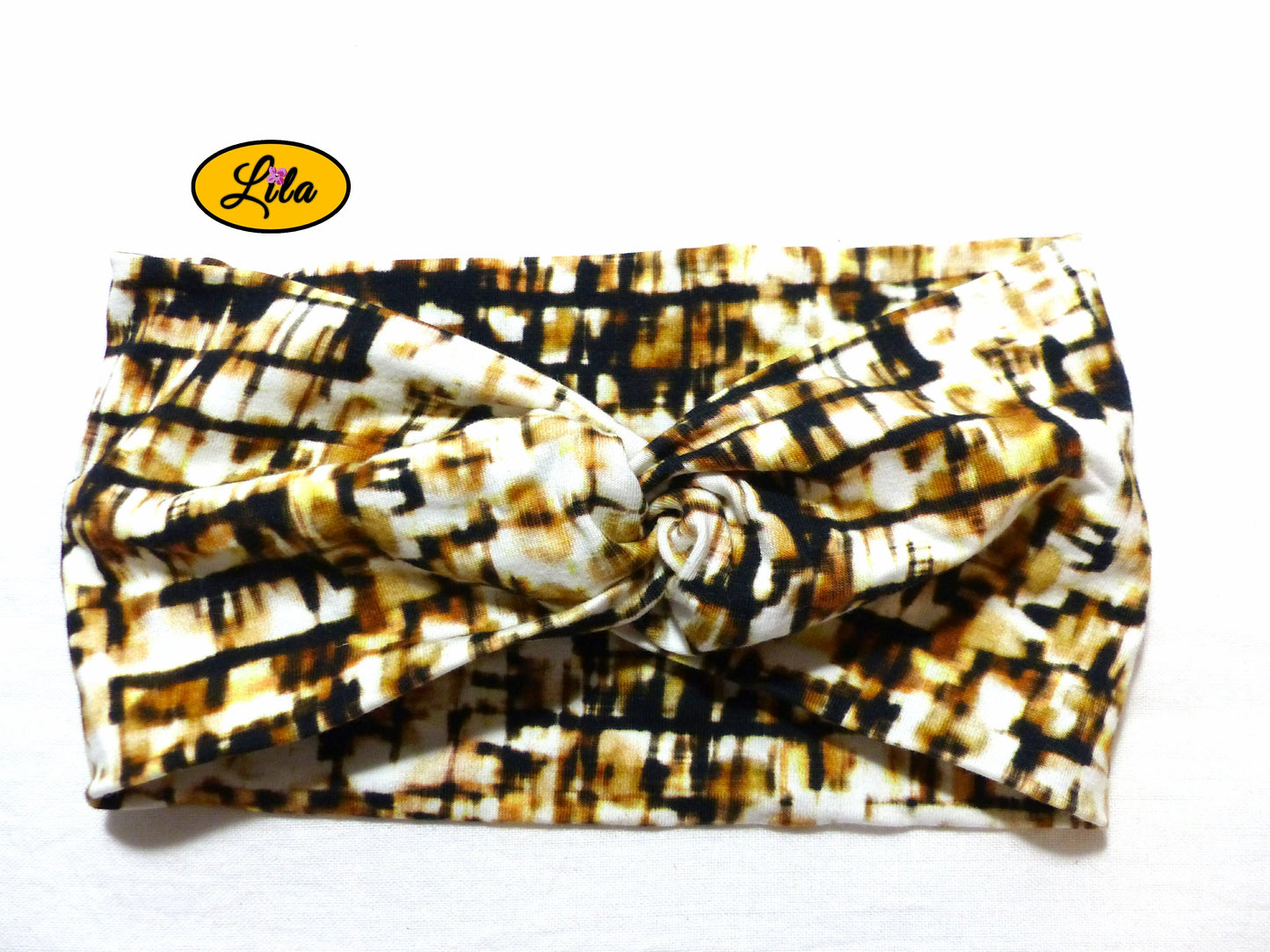 Bandeau en tissu blanc et marron vu de face sur fond blanc style bohème et féminin