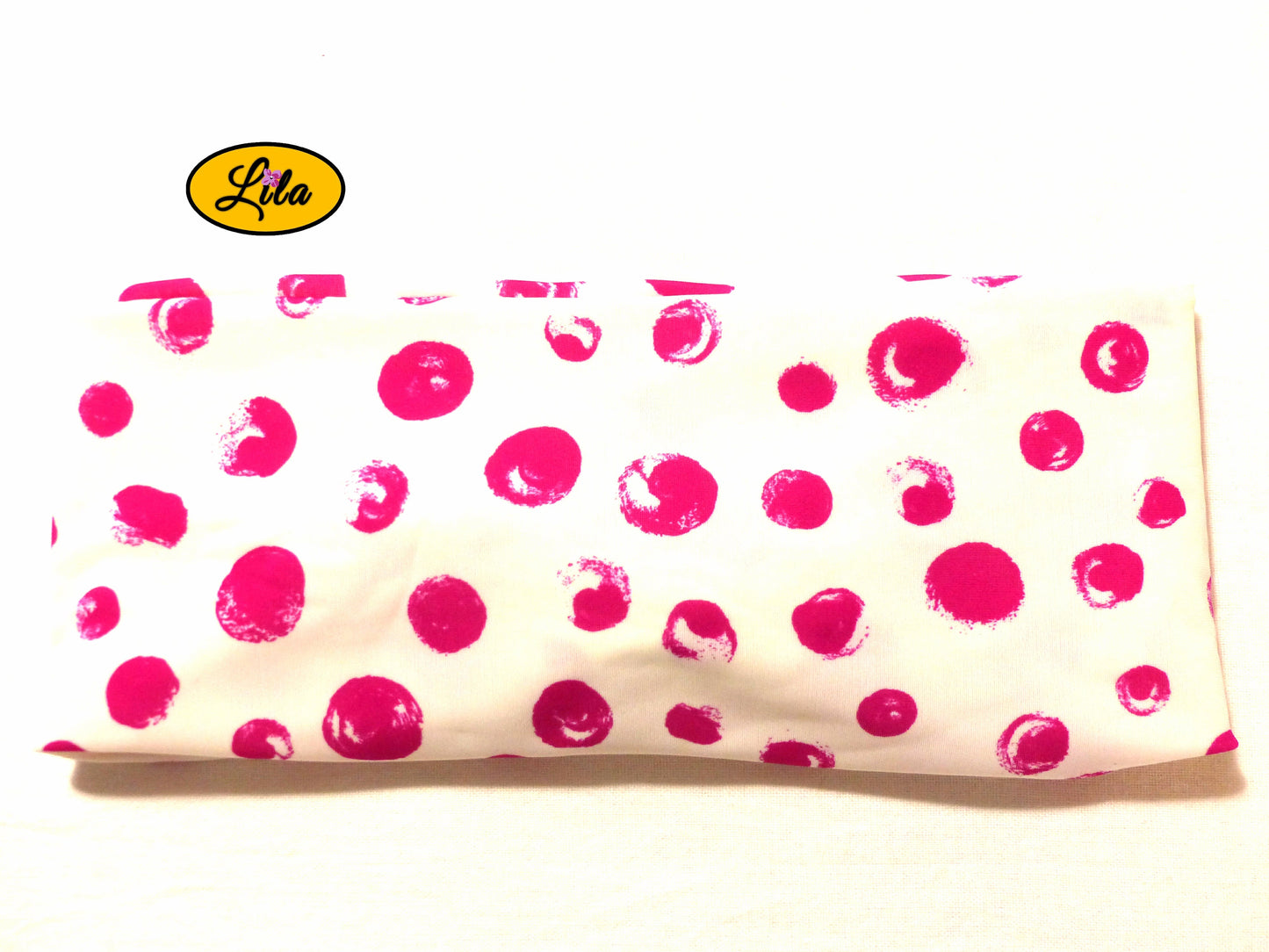 Bandeau en tissu blanc à ronds roses vu de dos sur fond blanc style doux et tendance