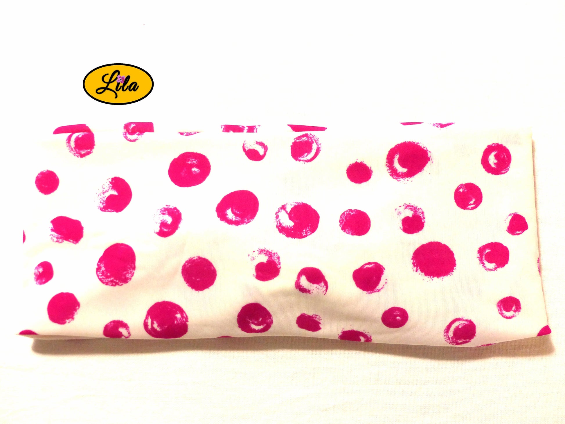 Bandeau en tissu blanc à ronds roses vu de dos sur fond blanc style doux et tendance