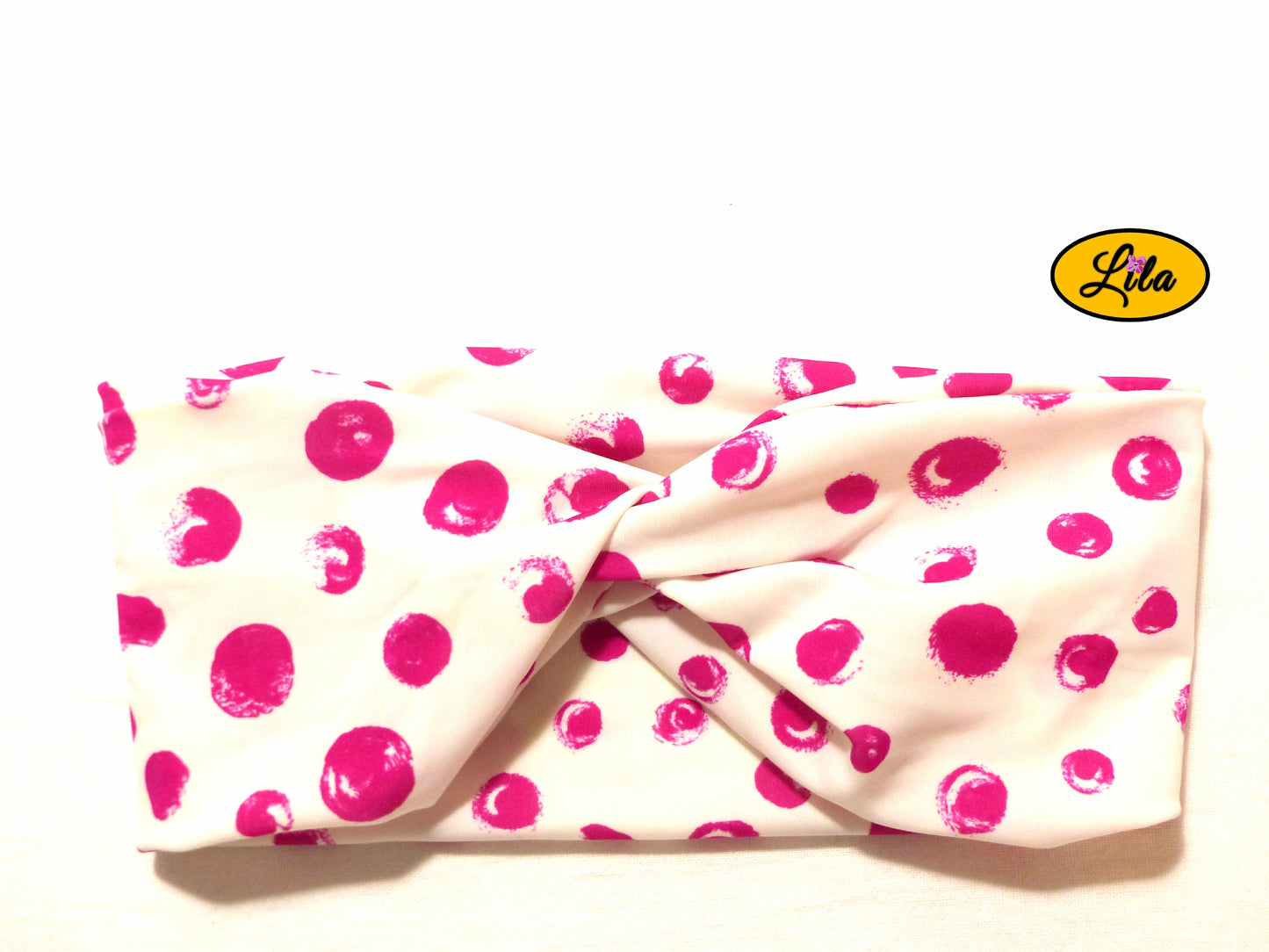 Bandeau en tissu blanc à ronds roses vu de face sur fond blanc style rétro et féminin