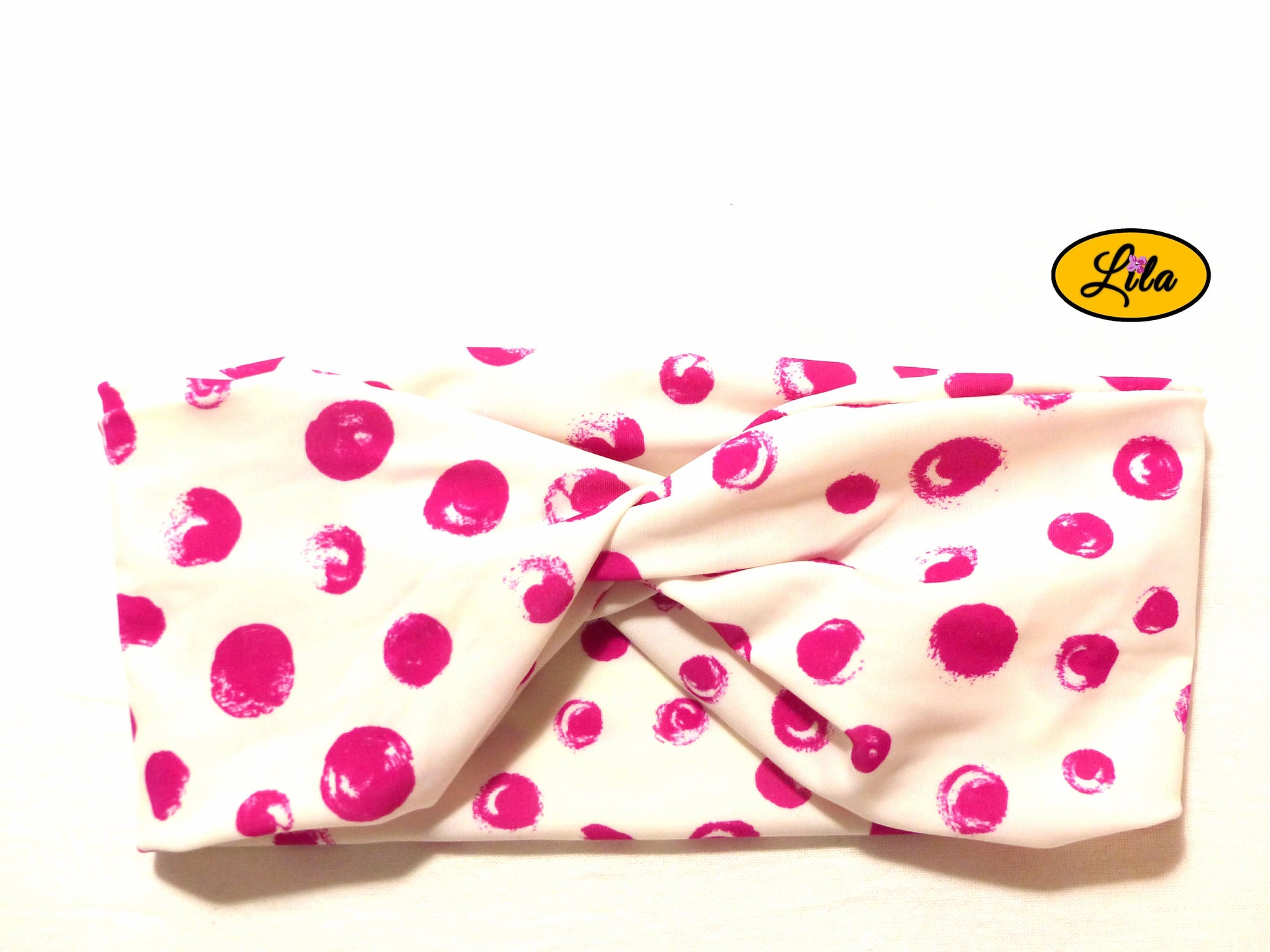 Bandeau en tissu blanc à ronds roses vu de face sur fond blanc style rétro et féminin