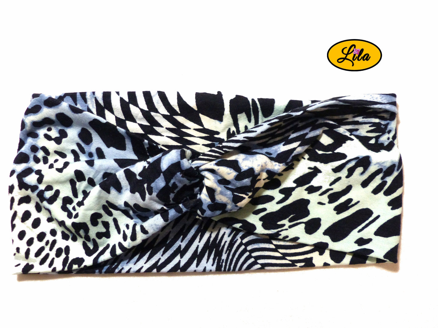 Bandeau en tissu bleu à motifs noirs vu de face sur fond blanc style moderne et féminin