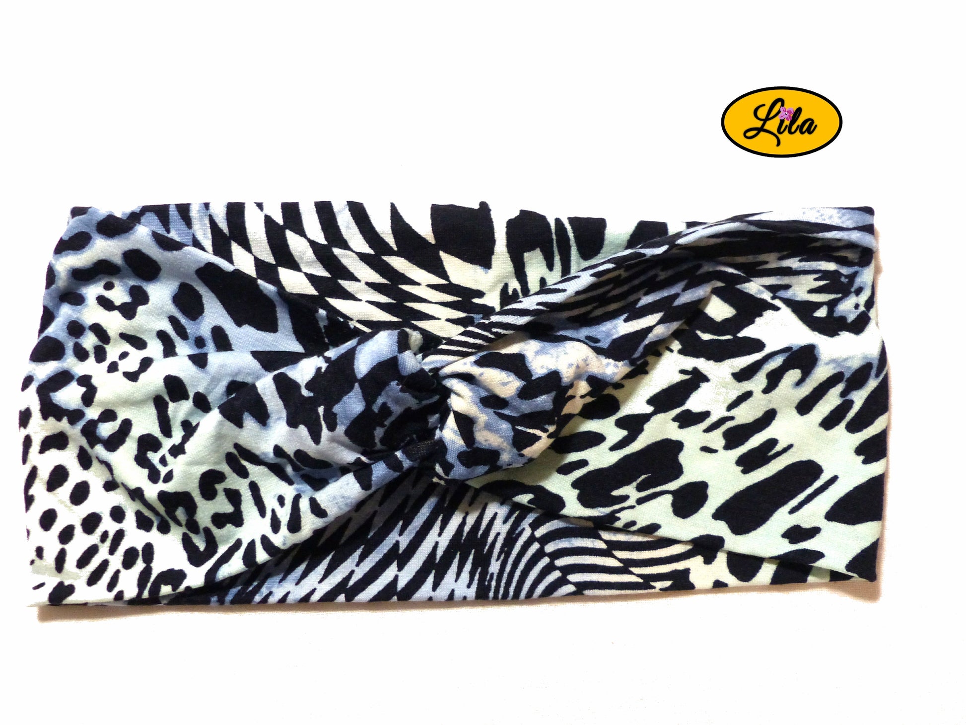 Bandeau en tissu bleu à motifs noirs vu de face sur fond blanc style moderne et féminin