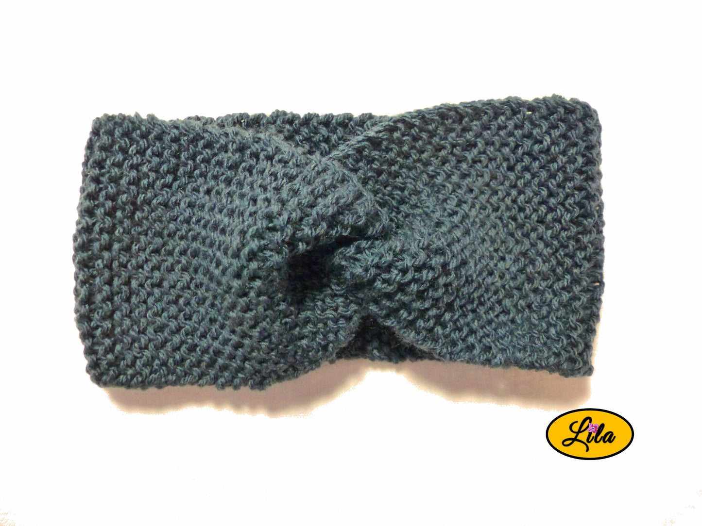 Bandeau en laine bleu foncé vue de face sur fond blanc style hiver élégant et intemporel
