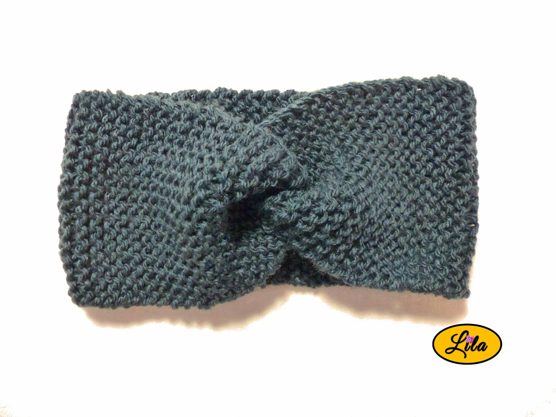 Bandeau en laine bleu foncé vue de face sur fond blanc style hiver élégant et intemporel