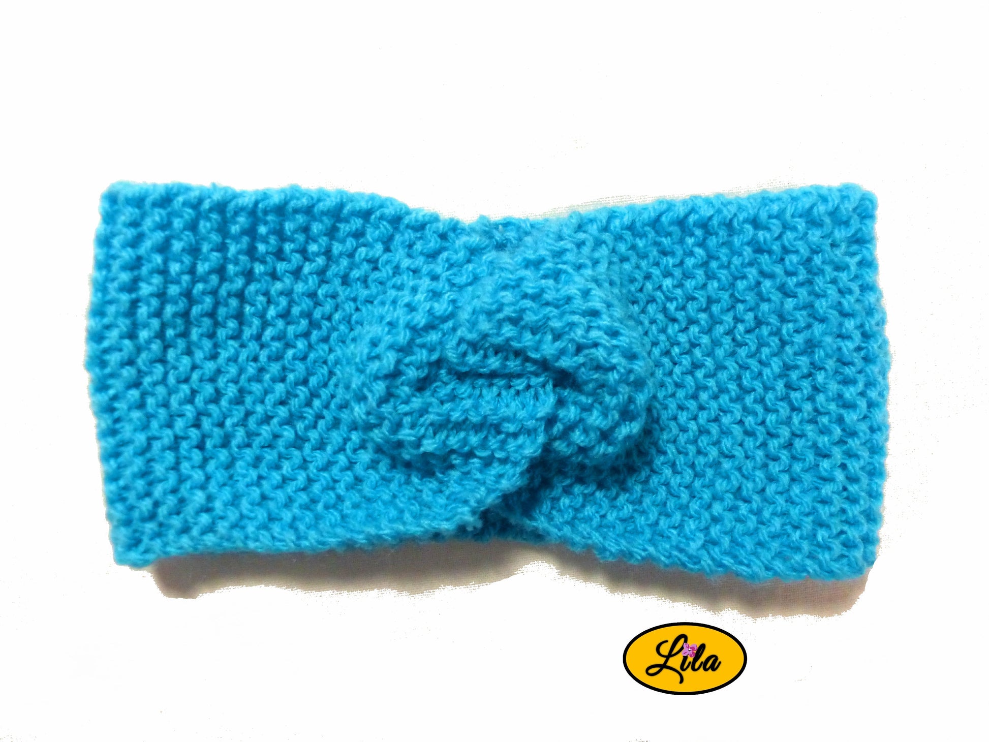 Bandeau en laine turquoise vue de face sur fond blanc style hiver lumineux et moderne
