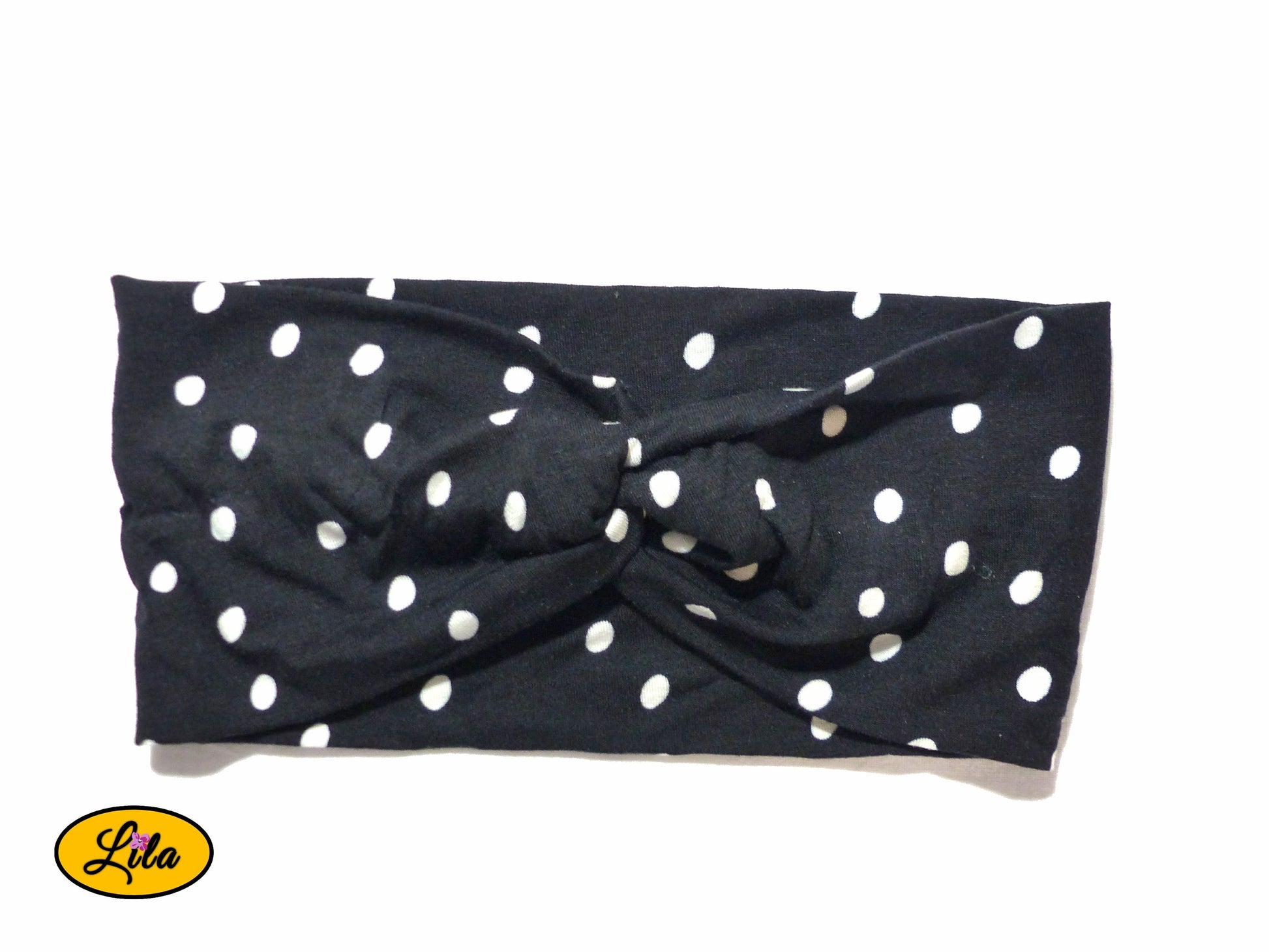 Bandeau en tissu noir à pois blancs vu de face sur fond blanc style rétro et féminin