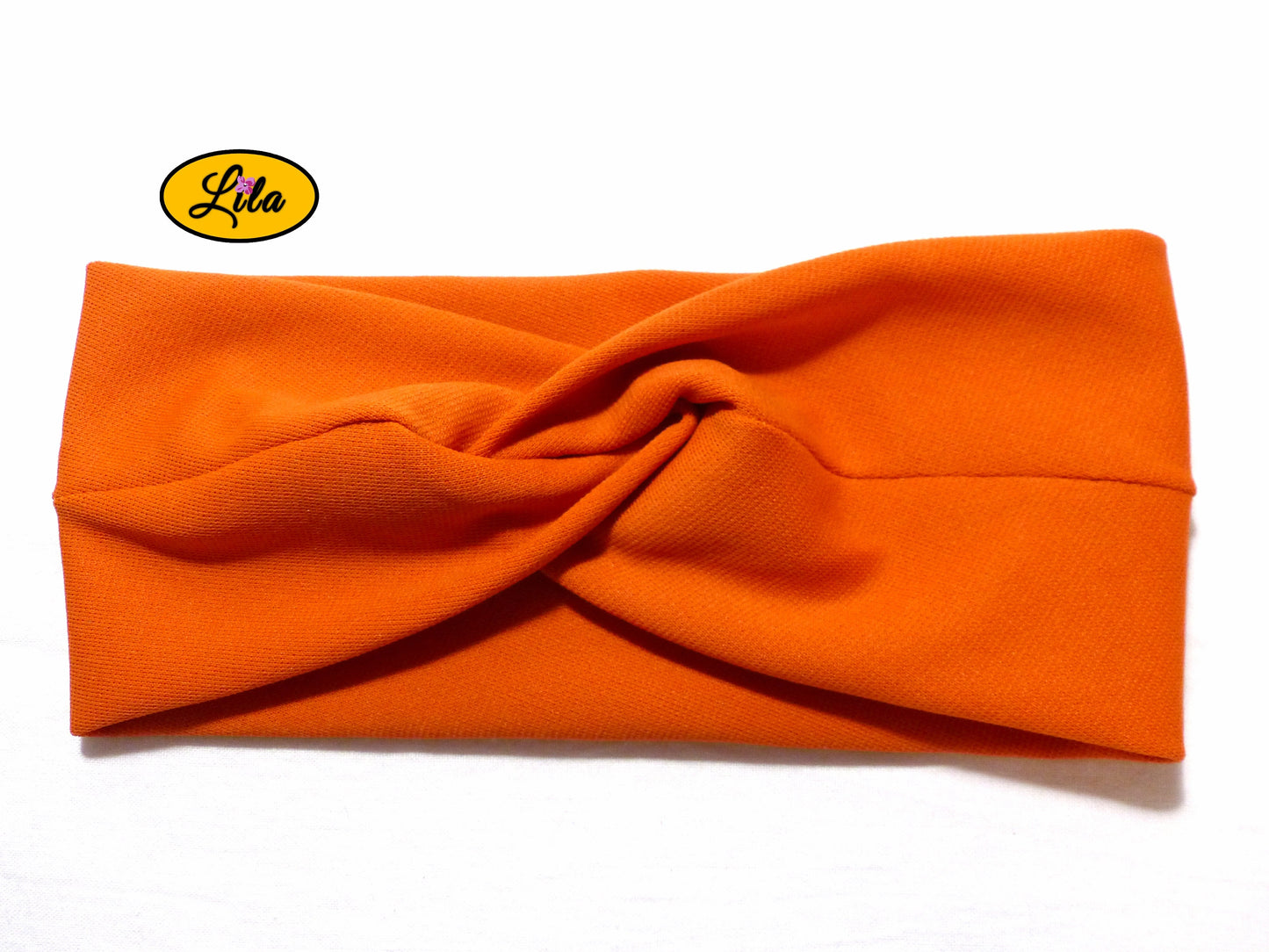 Bandeau en tissu orange vu de face sur fond blanc style moderne et tendance