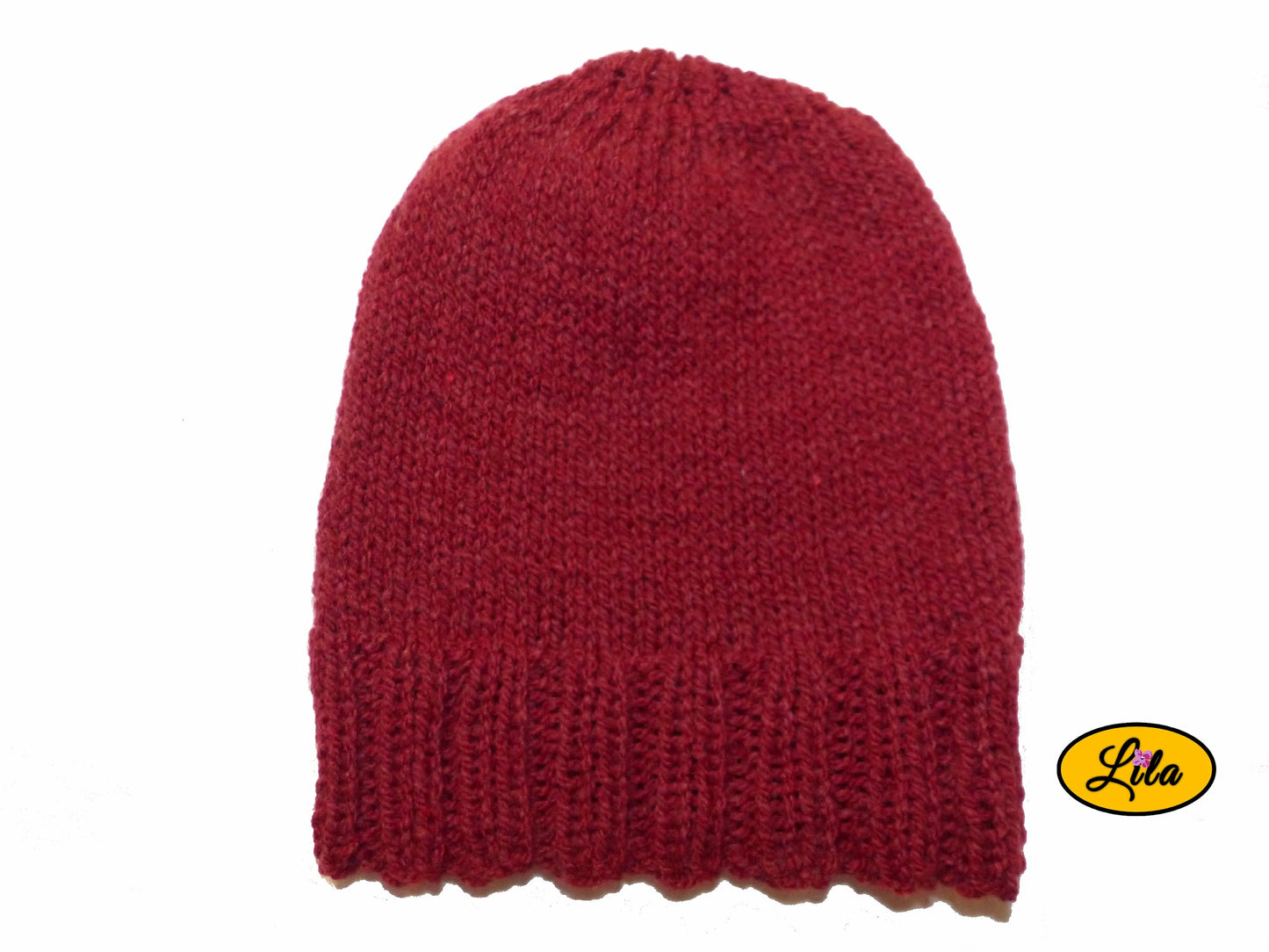 Bonnet en laine rouge sur fond blanc style hiver chaud et festif