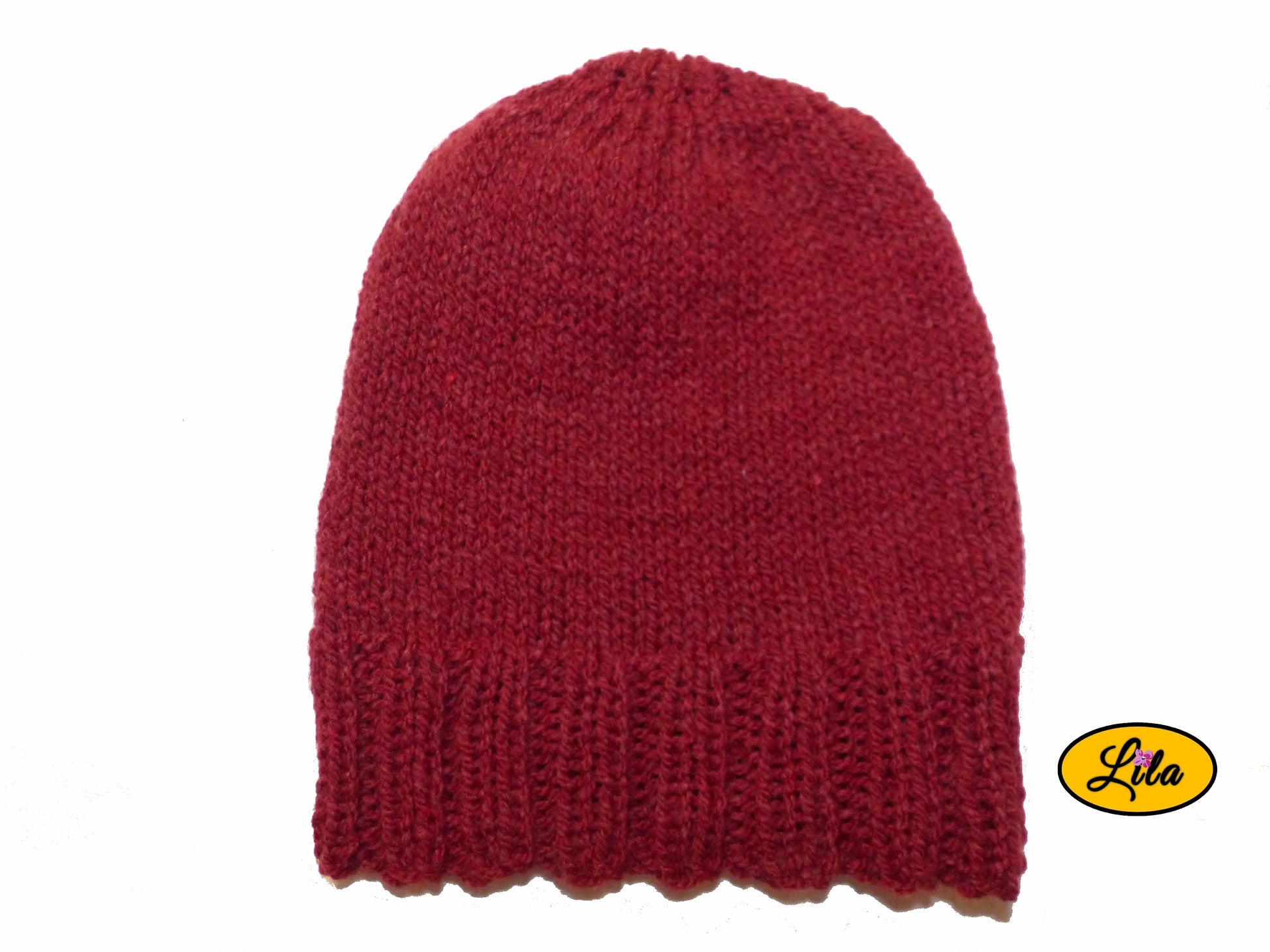 Bonnet en laine rouge sur fond blanc style hiver chaud et festif