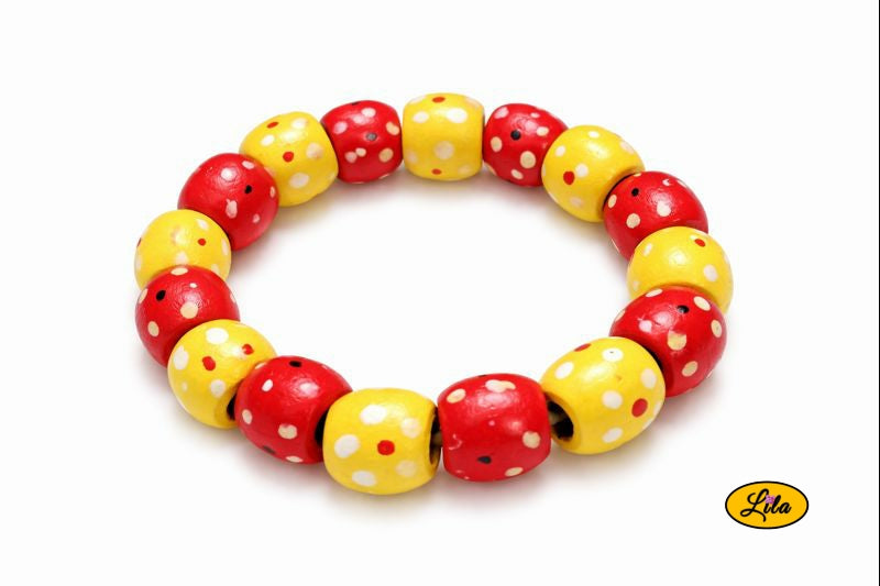 Bracelet perles bois jaune et rouge à pois blancs sur fond blanc vue produit