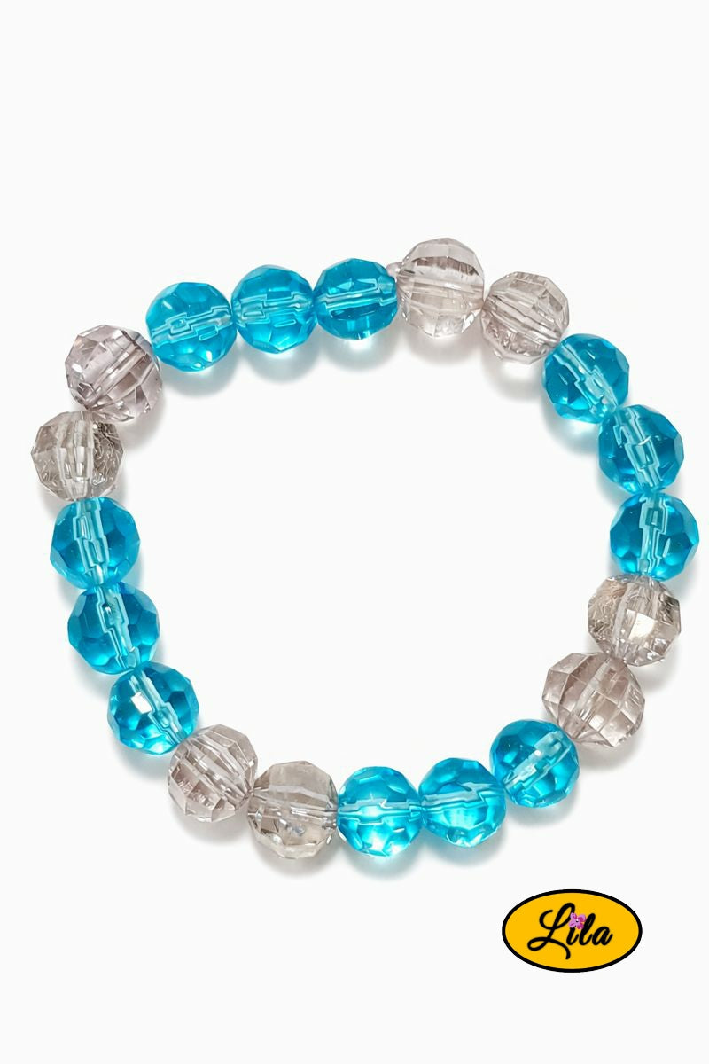 Bracelet perles transparentes et bleu ciel sur fond blanc vue produit