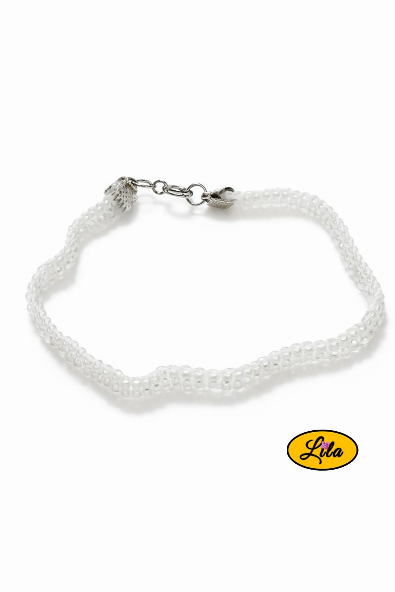 Bracelet tissé perles de rocailles blanches vue inclinée de profil