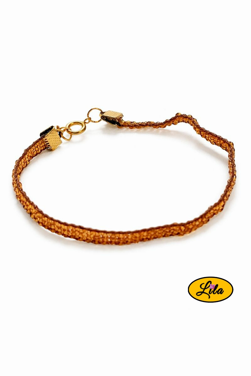 Bracelet tissé perles de rocailles dorées vue de profil