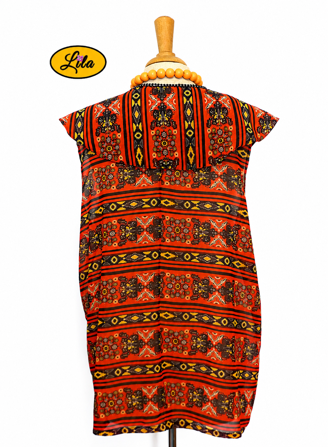 Chemisier Delphine sans manches en tissu léger orange et noir vu de dos sur mannequin de couture style rétro et féminin