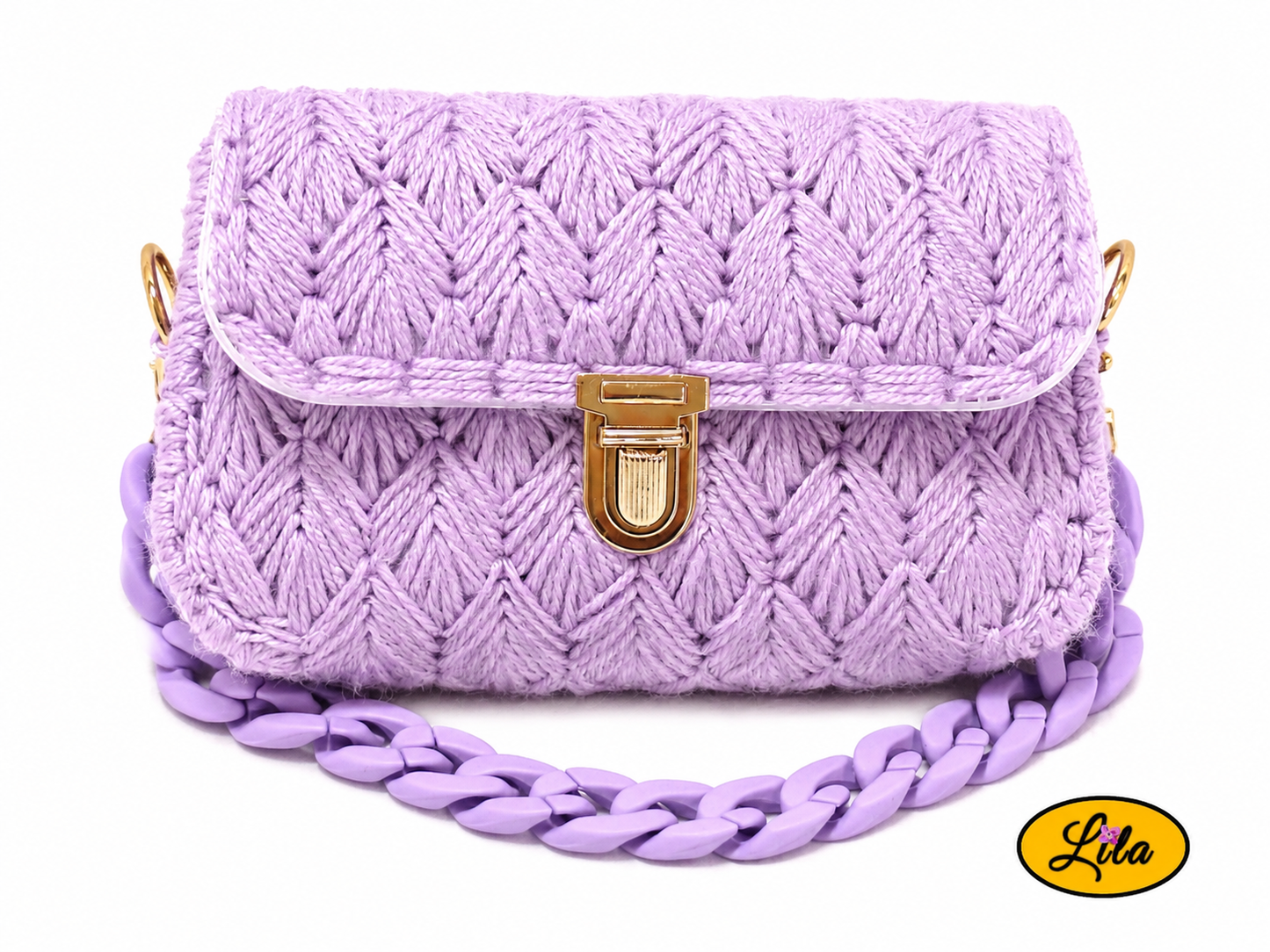 Petit sac à main aux brins lilas sur canevas rigide vue de face sur fond blanc avec chaîne lilas en grosse maille placée sous le sac style doux et créateur
