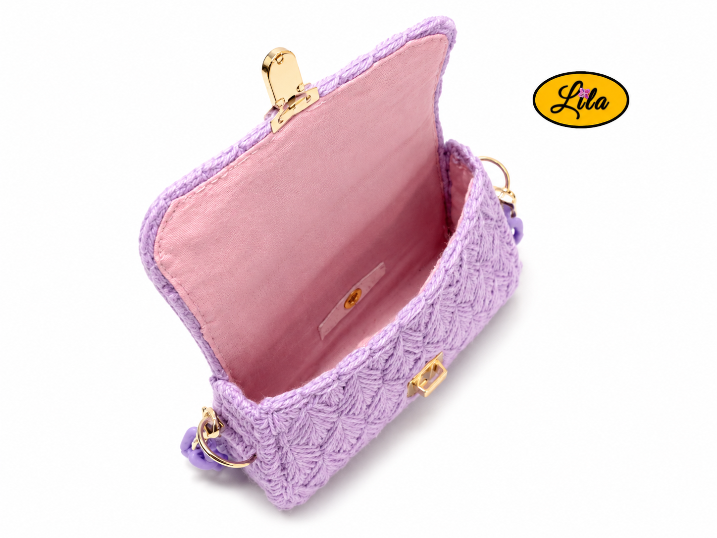 Vue de haut du petit sac à main aux brins lilas ouvert sur fond blanc avec doublure rose visible et fermeture du sac