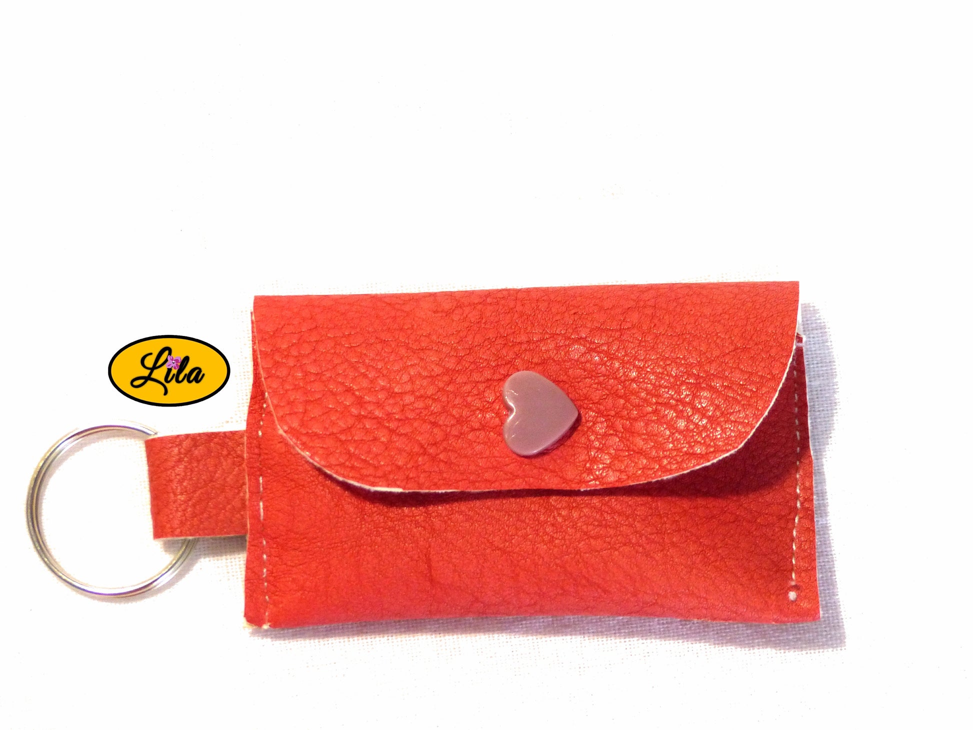 Porte-clé mini pochette rose en simili cuir vue de face