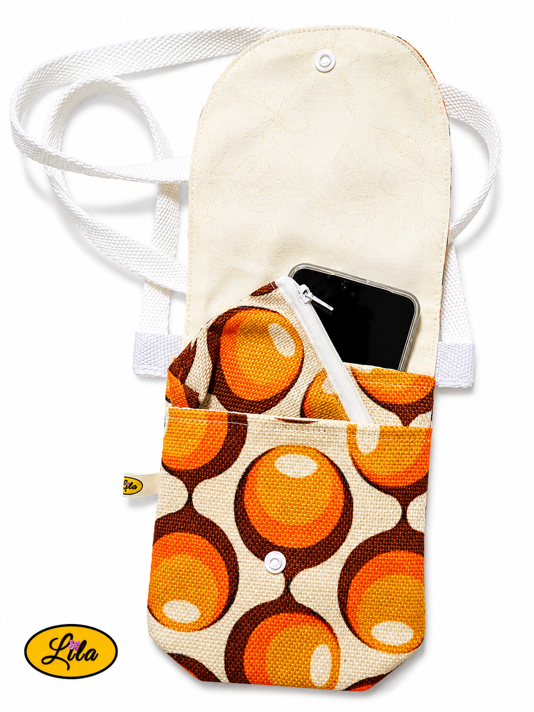 Sac bandoulière pour téléphone aux motifs vintage orange et brun, ouvert avec GSM dans le compartiment arrière et porte-monnaie dans la pochette avant