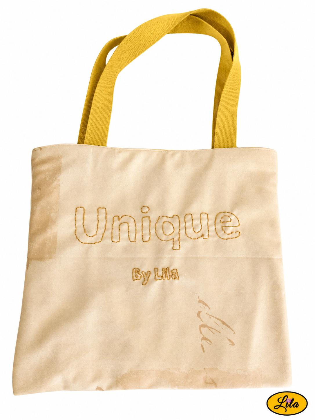 Tote bag jaune vu à plat de haut sur fond blanc avec sangle jaune recyclée et broderie artisanale « UNIQUE by Lila » sur le devant du sac style fait main et original