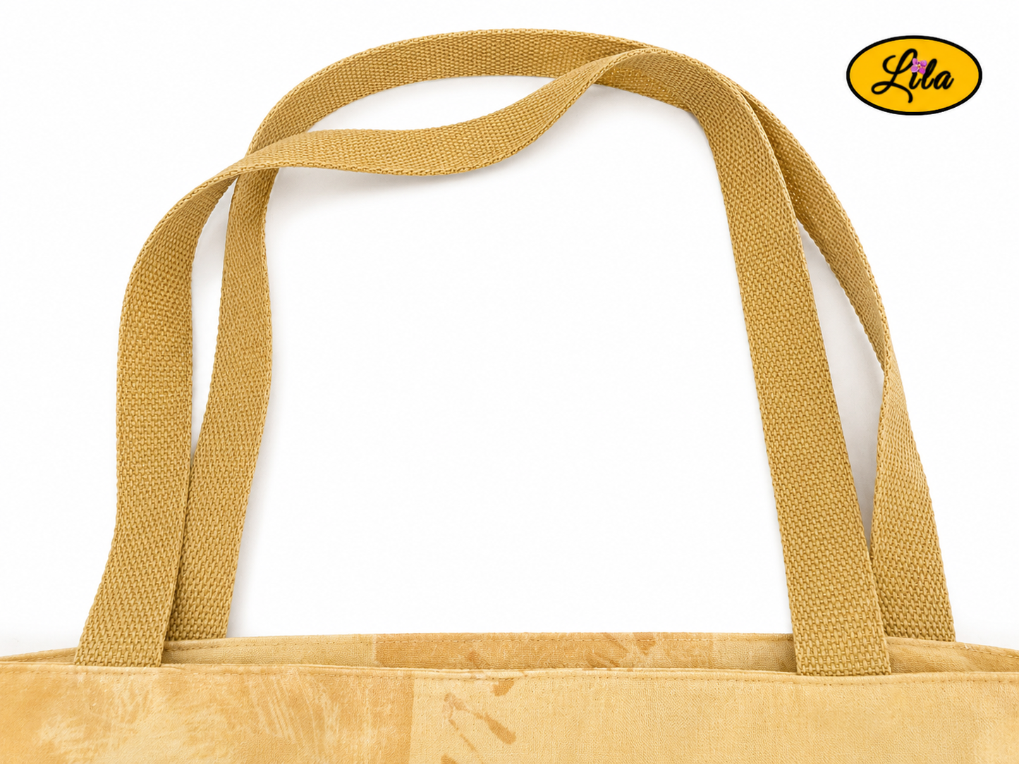 Zoom sur les sangles d’un tote bag jaune orné d’une broderie artisanale cœur et tête de cheval sur fond blanc style fait main et original