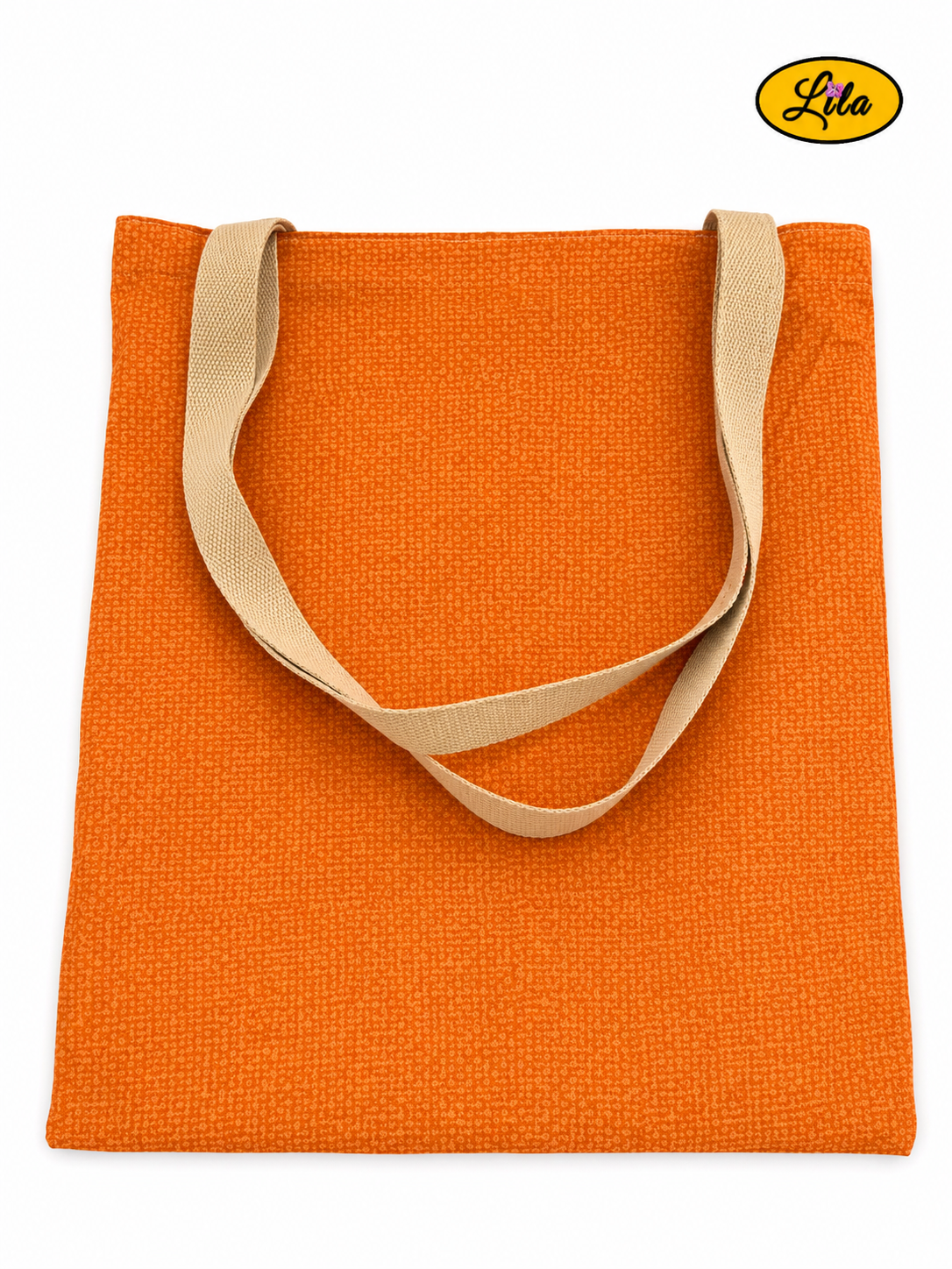 Tote bag orangé vu de dos en vue de haut sur fond blanc avec les sangles couleur sable posées sur le sac style artisanal et élégant
