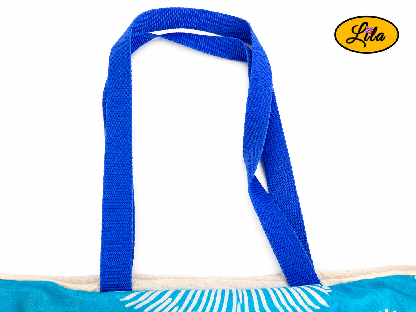 Zoom sur les sangles d’un tote bag bleu turquoise orné de trois soleils géométriques argentés sur fond blanc style artisanal et soigné