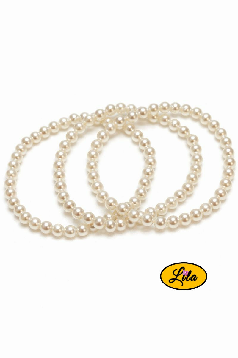 Trio de bracelets perles nacrées rondes sur fond blanc vue produit
